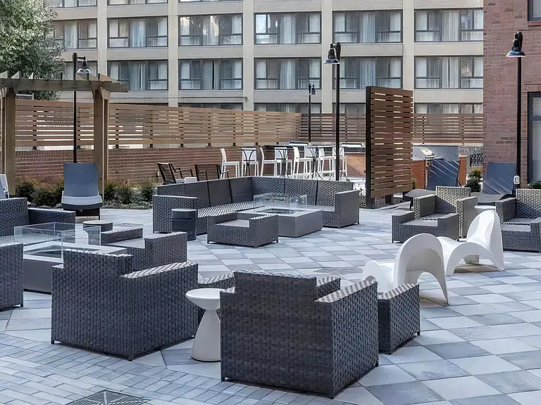 Patio Lounge Featuring Sectional Furniture and Fire Tables