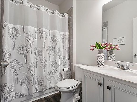 Frist floor bath 1, inlaws/guest bath with low set bath/shower entry