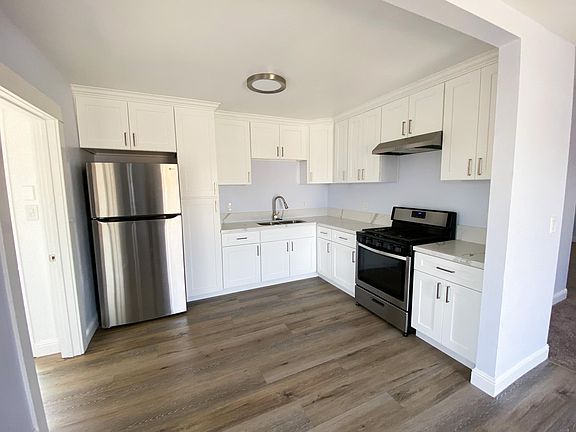 Kitchen with new refrigerator and stove