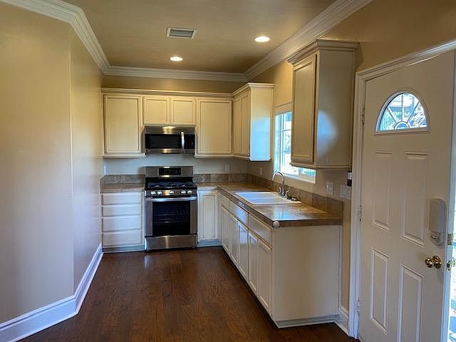 Kitchen with new stove & microwave