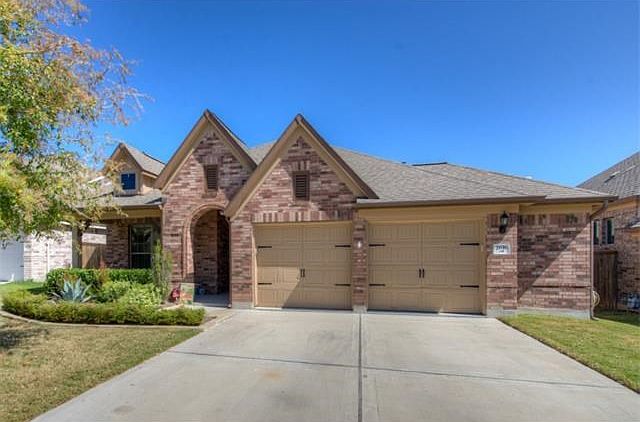 Exterior Front, Two car garage with extra 5 ft space inside for storage, etc.