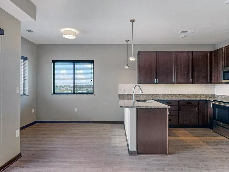 Dine and entertain in this bright nook, conveniently located next to the kitchen.