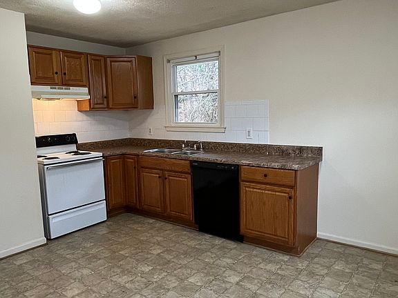 Eat-in kitchen with dishwasher.
