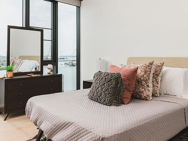 Well appointed and brightly lit bedroom featuring stunning views