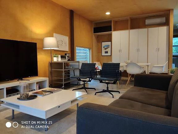 Large living / dining area with plenty of storage cabinet