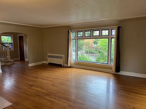 Large Living Room on Main with Hardwood Floors Warm Radiant Heat and Fireplace