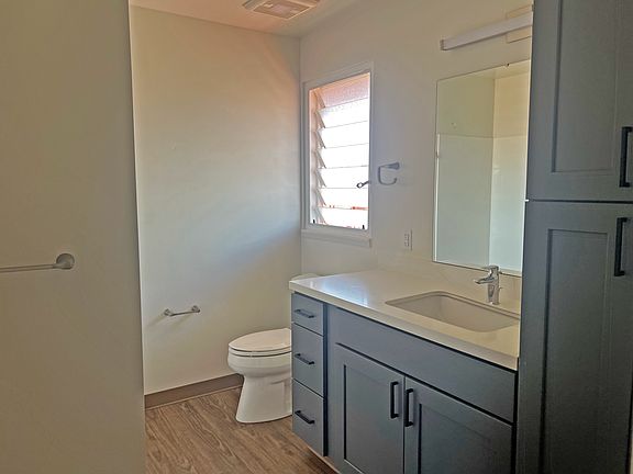 Contemporary bathroom with generous counter space and stylish cabinets.