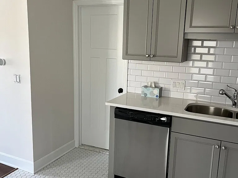 Kitchen looking at door to bathroom.