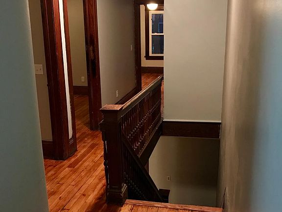 Historic charm with original floors, railins, trim