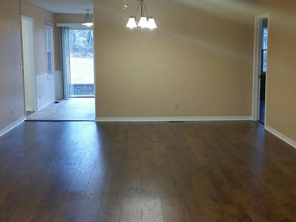 Open living and dining looking into breakfast area off of ki