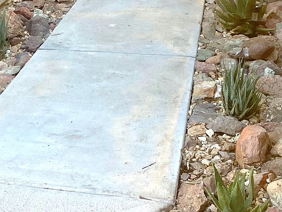 Dryscape lines the walk way to the front door.