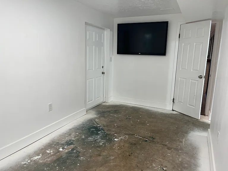 Downstairs gym. Door to left leads outside