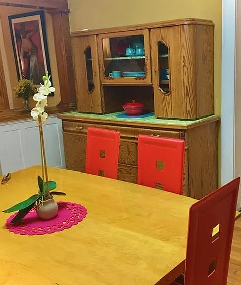 Dining table for 6. German china cabinet with Fiestaware.
