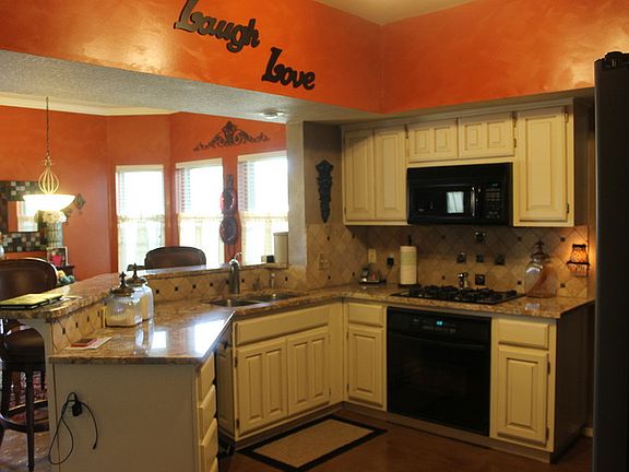 Kitchen
						:
						Custom, designer floors, granite counter tops; opens to breakfast nook and den.