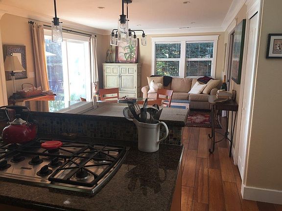 Kitchen with 48" round glass table and combo family room