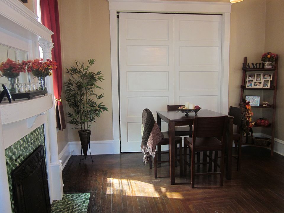 Living room with sliding doors closed, bedroom behind the doors