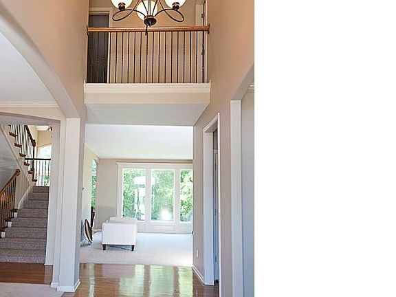 View from entry--note the gleaming hardwoods & new stairway carpet