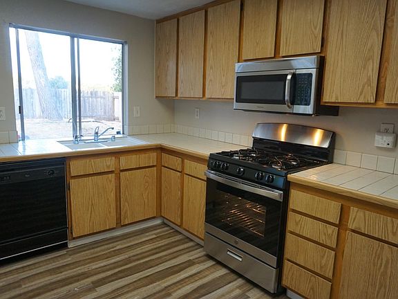 Kitchen with brand new range/oven/broiler. Like new microwave and dishwasher.