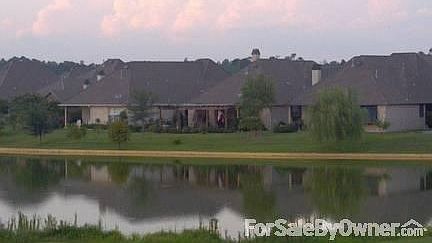 VIEW FROM ACROSS LAKE
						:
						View from 9th hole.