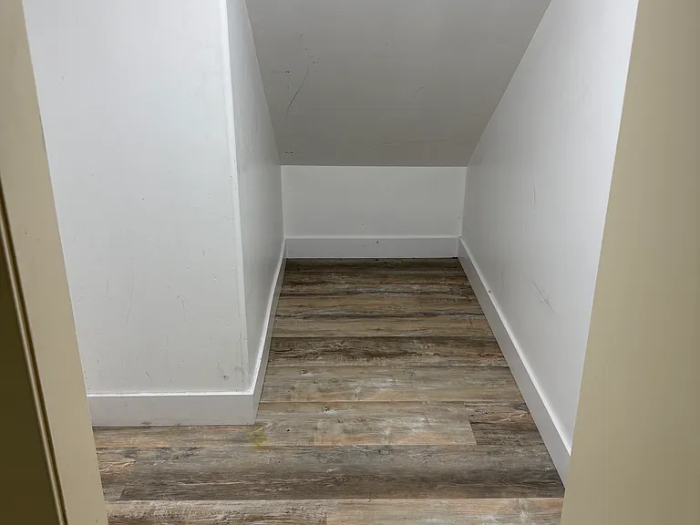Extra storage space under the stairs.