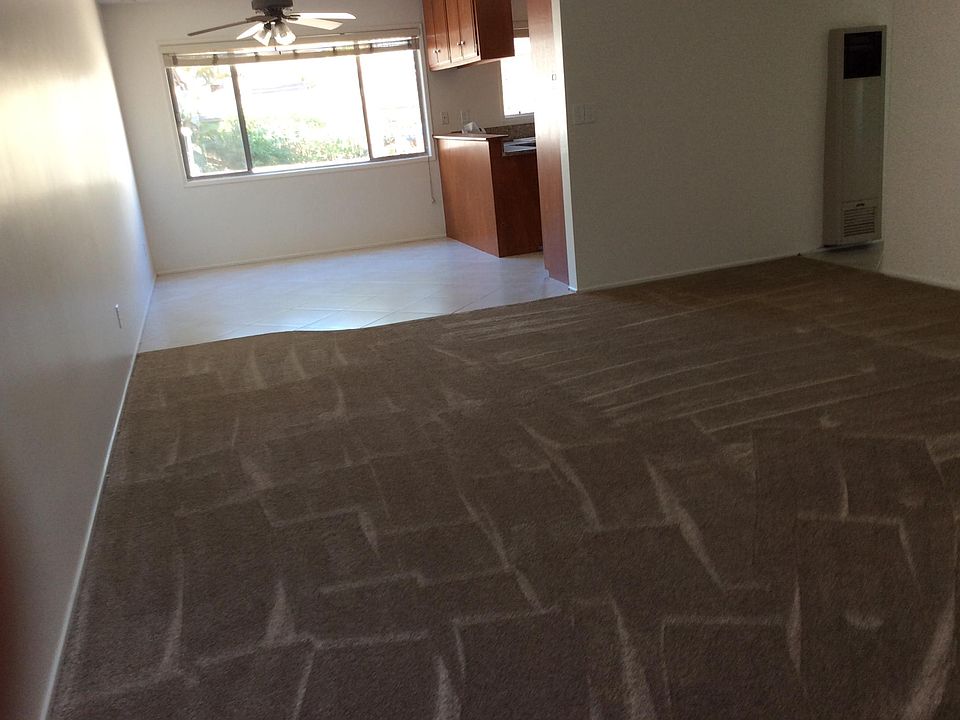 View of living room to dining room table area with ceiling f