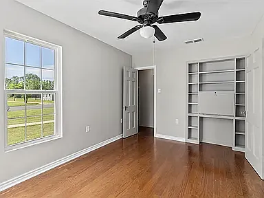 Second bedroom, with built-in desk. 3rd bedroom not pictured.