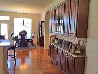 Hardwood floors, shelves, and granite