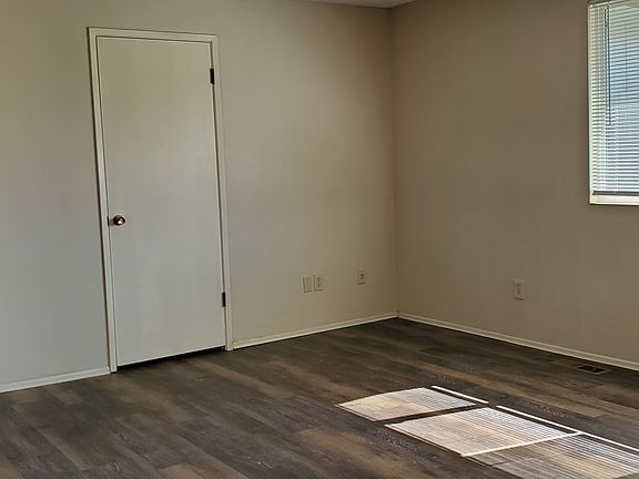 View of living area and hall to bathroom and bedrooms