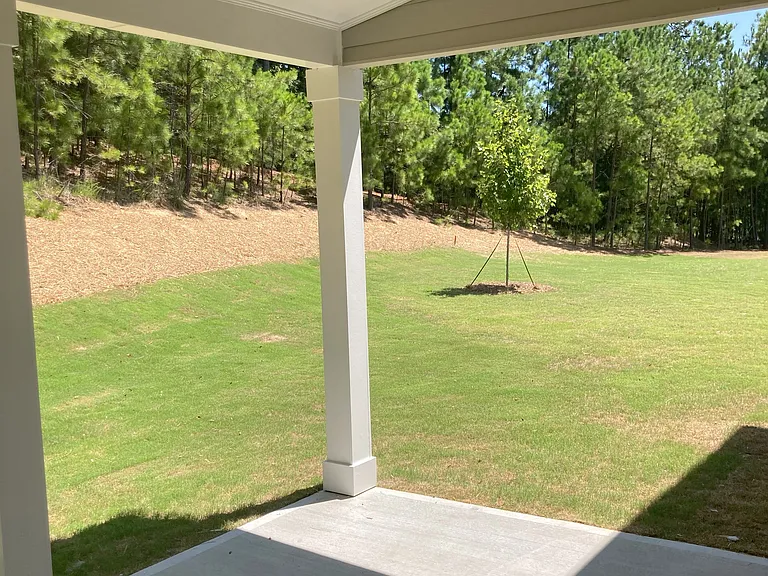 Covered patio with privacy wall on one side