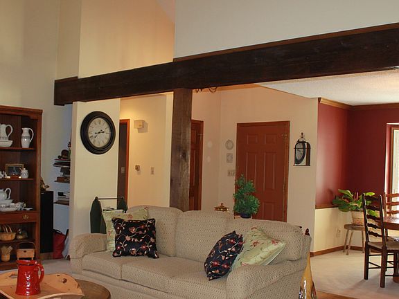 Beautiful exposed beam in the open Living and Formal Dining Areas