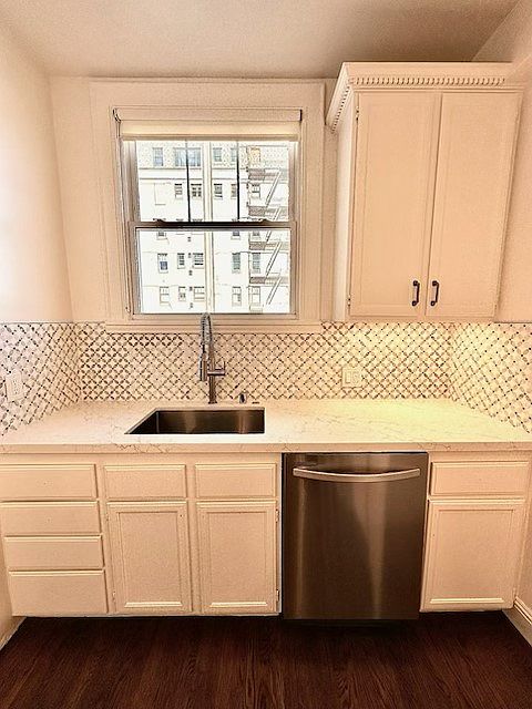 Unit #504 stunning chefs kitchen with marble countertops custom backsplash and stainless steel appliances including gas stove!