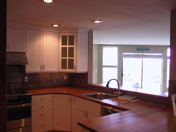 kitchen to living area: plenty of storage AND view of Puget Sound and Olympics