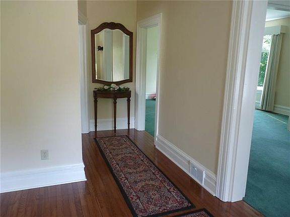 Entry features beautiful hardwood floors.