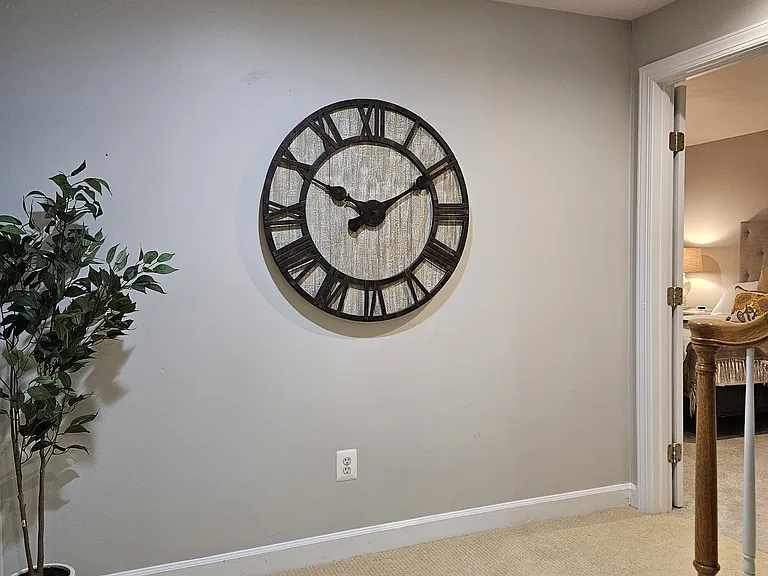 Large queen bedroom to right of clock.