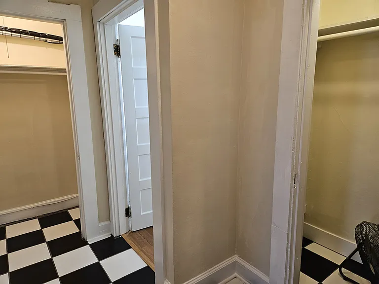Hallway with doors open.