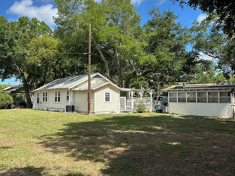 Garage and storage shed detached from house.