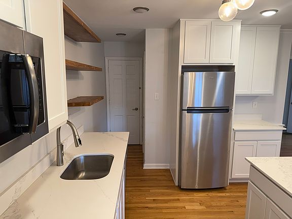 That recessed door on the left leads down into the basement.