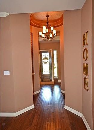 Note the gorgeous wood floors and interesting architectural details.