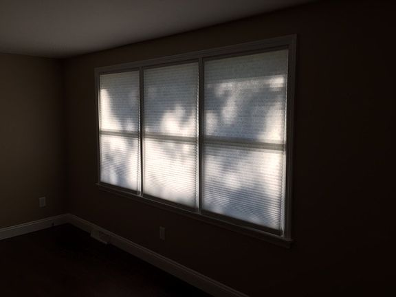 Light filtering shaed on all windows in living area. Blackou