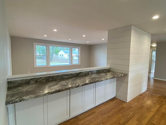 kitchen, bar overlooking living room