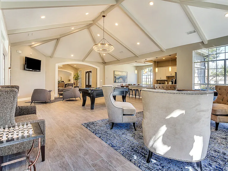 Modern resident lounge with entertainment areas, games and lounge seating