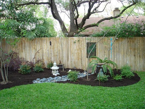 Enjoy the view of the custom landscaping.