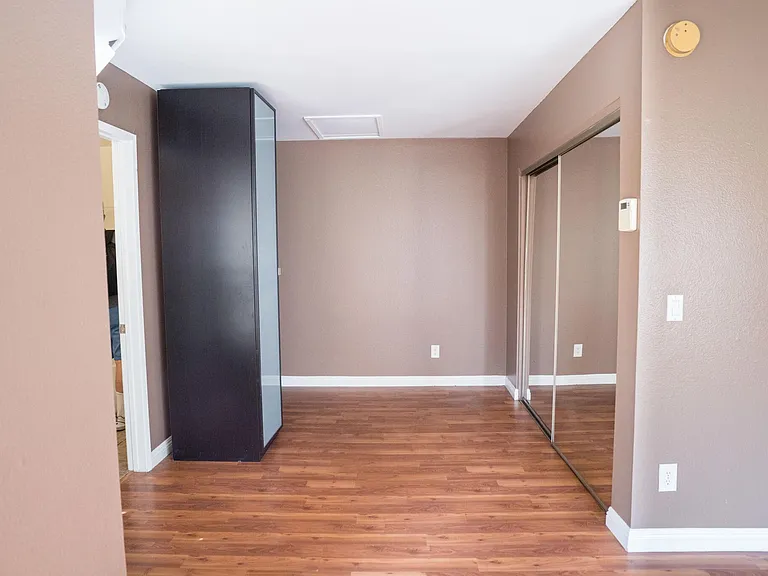 Bedroom space. The black standing closet/shoe rack can be moved or even disposed of.