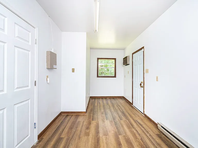 Located off the living room and primary bedroom. Could be used as an office, mud room, or walk in closet for the primary bedroom!