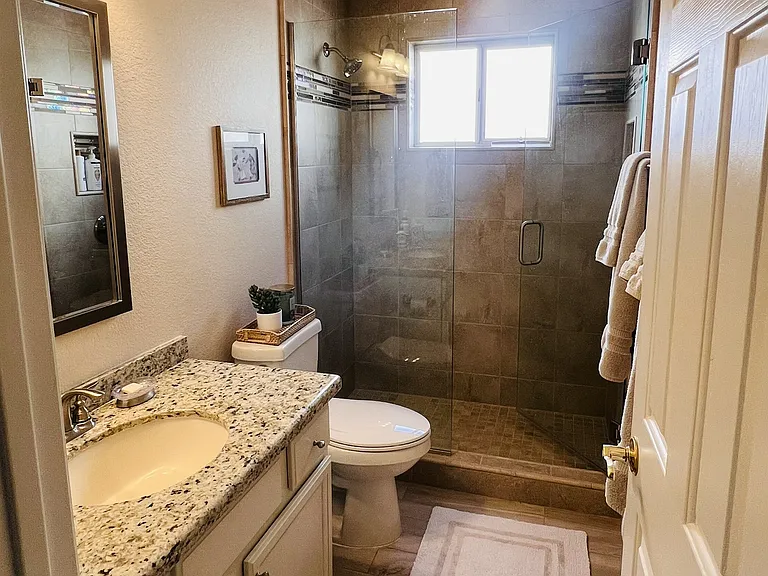 2nd bathroom with slider door between living area to create an en suite guest quarters if needed.
