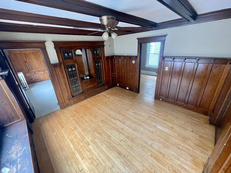 Living room featuring built-in cabinets.