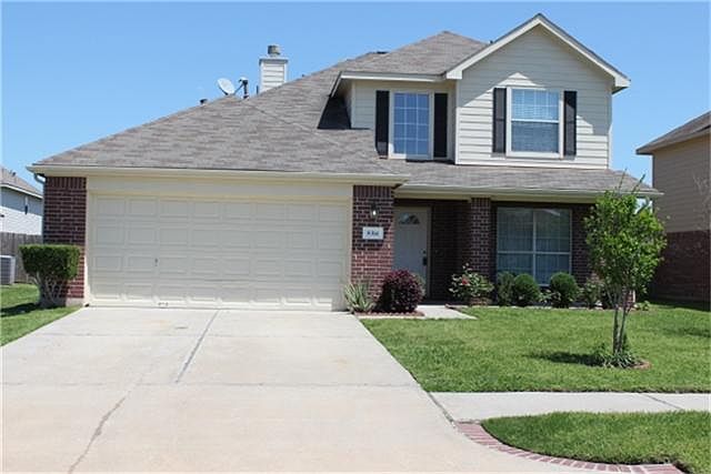 Front view of home with easy care landscaping