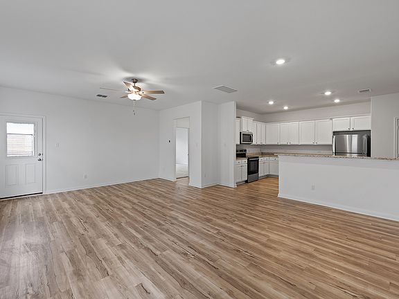 The spacious family room that leads into the kitchen