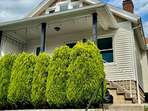 Front steps lead to a private front porch ready for fall nights!