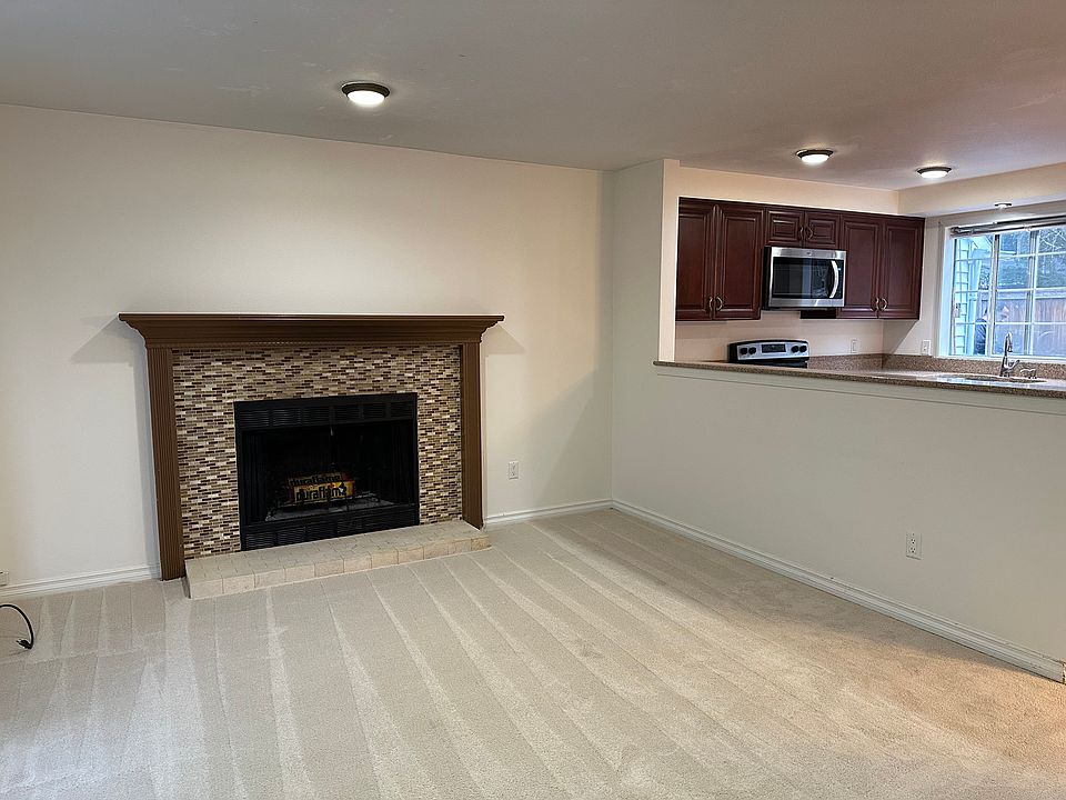 New Carpet in Living Room with Fireplace